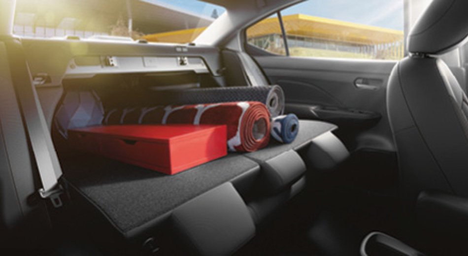 Interior of Sunny with back seats down for more boot space